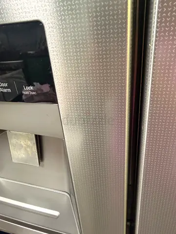 LG stainless steel side by side refrigerator with built in water and ice dispenser
