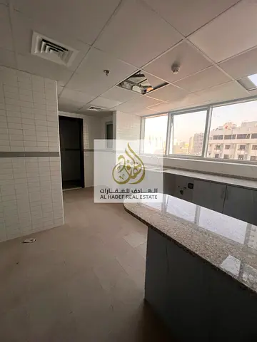 For rent in Sharjah, Al Majaz 1 area: three bedrooms, living room, maid's room, four bathrooms, sto