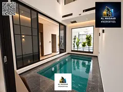 Modern villa with a swimming pool and a high-end foyer. Price includes transfer fees and air conditi