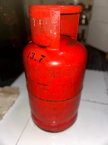 Half Filled Gas Cylinder with Pipe and Regulator