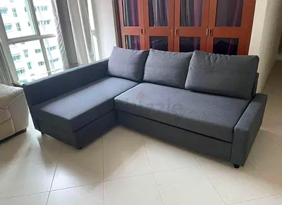 L-shaped grey fabric sofa — good condition, solid frame