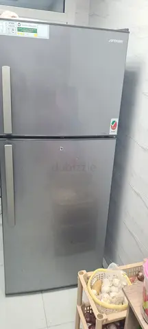 Well-maintained double-door refrigerator (top freezer) - stainless finish