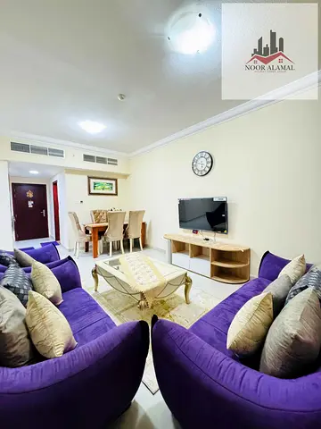 Sharjah, Al Taawun area: Two-bedroom apartment with a living room, kitchen, two bathrooms, and a ba