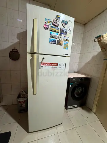 White double-door refrigerator in good working condition