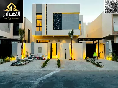 A luxurious two-story villa with a rooftop terrace in Al Zahia, fully equipped with electricity, wa