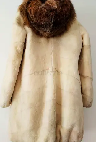 2 lynx fur coats, both with hoods.