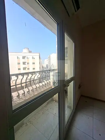 One-bedroom apartment with a living room for rent in Al Qulayaah, Sharjah, in a prime location close to services and public transportation. Suitable f