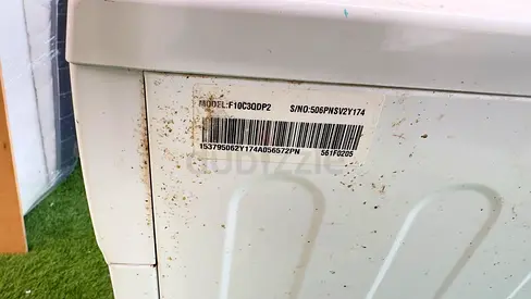 Used white top-load washing machine - some rust spots, works fine