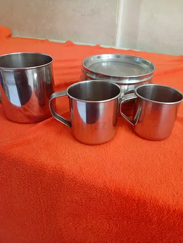 Set of stainless steel cups and container - used