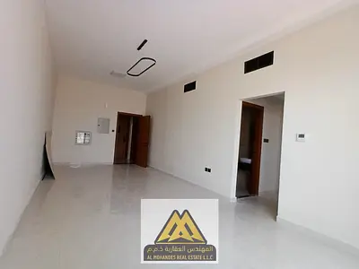 Brand-new 2BR apartment in Al Alia, Ajman. 2 baths, balcony, central AC, free maintenance, AED 46K, 4 or 6 payments.