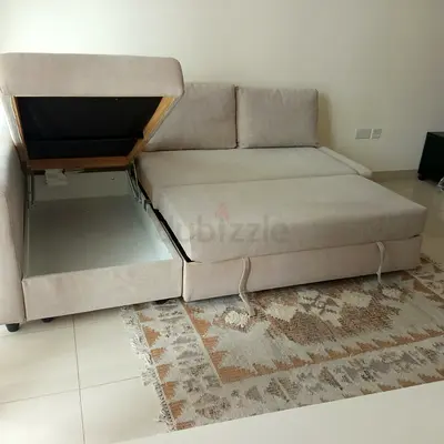 Beige L-shaped storage sofa bed - good condition