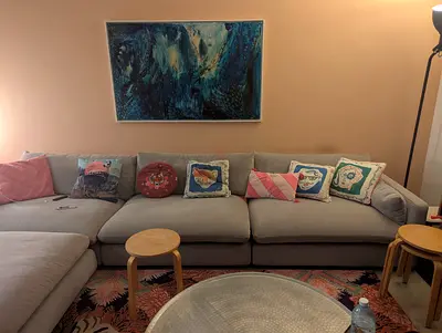 Light grey L-shaped sectional sofa in good condition