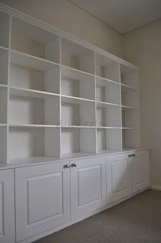 Built-in White Wall Bookcase with Lower Cupboards