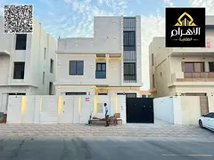 Luxury villa for sale in Al Bahia area – Ajman, two floors and a roof, at a special price includin