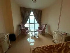 Two bedrooms and a living room, fully furnished with a full sea view | Corniche Residence Ajman