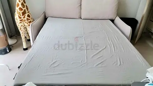 Convertible sofa bed (single/two-seater) in light grey - good condition