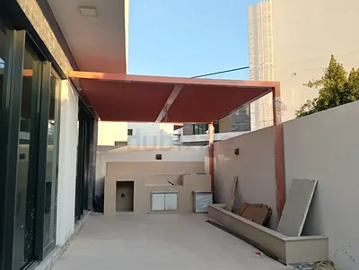 Outdoor pergola canopy frame with built-in BBQ counter area