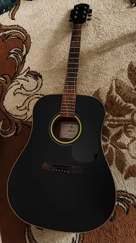 Used black acoustic guitar - playable condition, minor wear