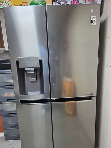 LG Stainless Steel Side-by-Side Refrigerator with Water Dispenser - Good Condition