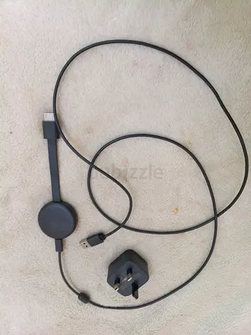 Google Chromecast (HDMI streaming dongle) with USB power cable and UK plug
