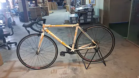 New white road bike - lightweight frame, drop handlebars