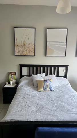 Ikea double bed frame black solid wood with mattress in excellent condition and 2 night stands.