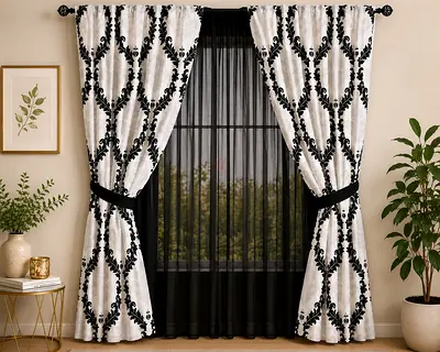 Pair of black and white patterned curtain panels with sheer inner curtain