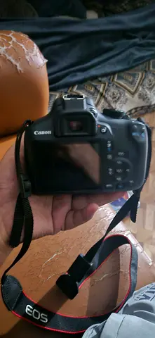 Canon EOS DSLR body with strap - used, good condition