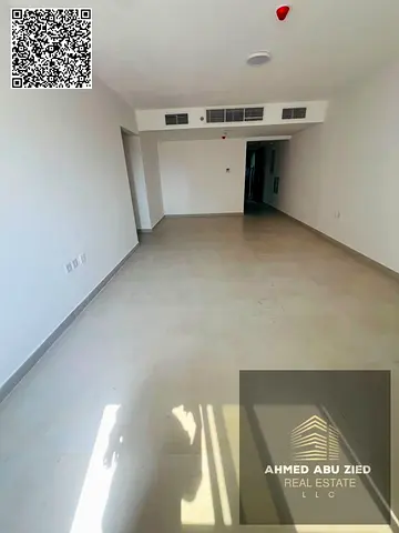 2BR hall in Al Mowaihat 1 with master room, 3 bathrooms, large kitchen and central AC; yearly rent