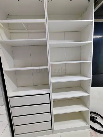 White freestanding wardrobe/wardrobe organizer with shelves and drawers