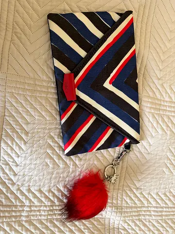 Kipling Striped Envelope Clutch with Red Fur Pom Keychain