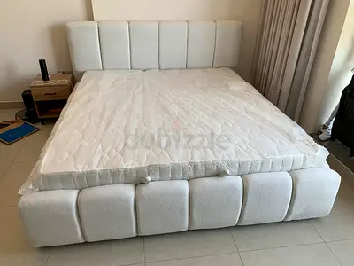White upholstered queen bed frame  good condition