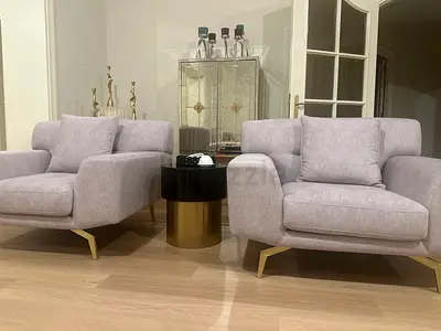 Pair of modern light-grey armchairs with gold legs