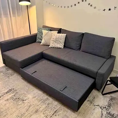 Modern L-shaped Grey Fabric Sofa with Pull-out Bed (Good Condition)