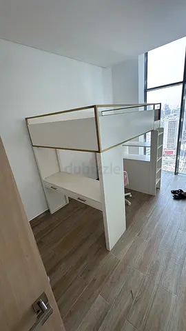 White loft bunk bed with built-in desk and storage - good condition