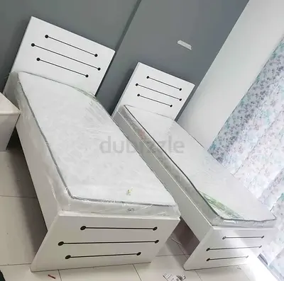 New Pair of single white wooden beds with mattresses