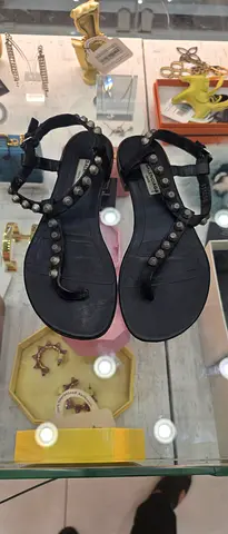 Black studded flat sandals, pre-owned, size unknown