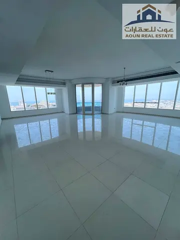 3-bedroom apartment with a living room available for annual rent in Al Majaz 3, featuring a view of Khalid Lagoon. Includes parking, a swimming pool,