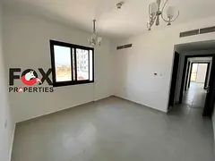 2BR + Hall for annual rent in Al Alia, Ajman. Brand-new building, first tenant, open-view balcony, 2