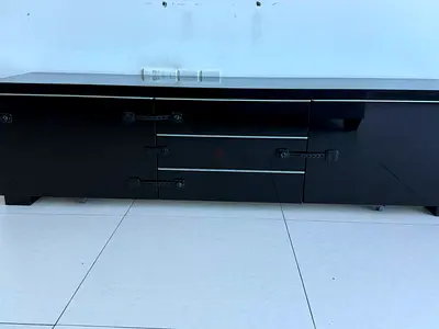 Black low TV cabinet / entertainment unit with drawers