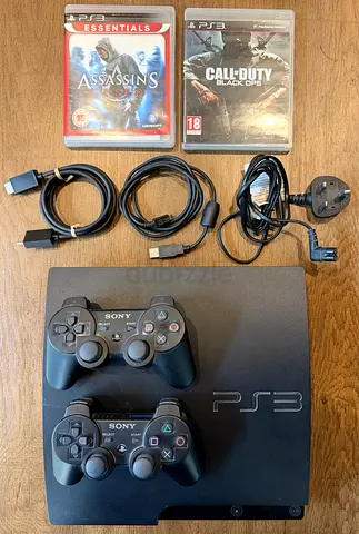Sony PlayStation 3 with 2 Controllers and 2 Games