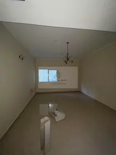 A one-bedroom apartment with a living room for rent in Al Qasimia, Sharjah, in a prime location clos