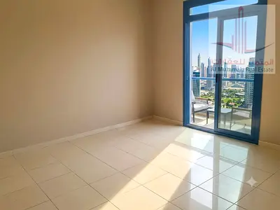 One bedroom and living room for rent in Al Rashidiya 3, excellent location with a balcony, close to the Ladies' Park