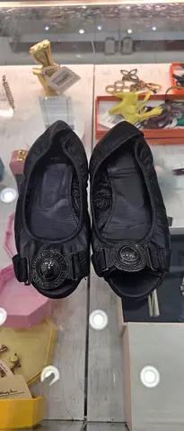 Black leather slip-on women's flats with decorative buckle - gently used