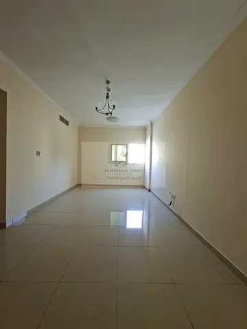 Spacious 2-Bedroom Apartment in New Muwaileh with Comfortable Living Room, Built-in Wardrobes, Parking, Prime Location Near Schools, Malls and Service