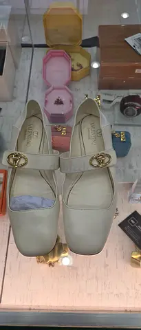 Valentino Garavani beige leather mules - size not stated, gently used