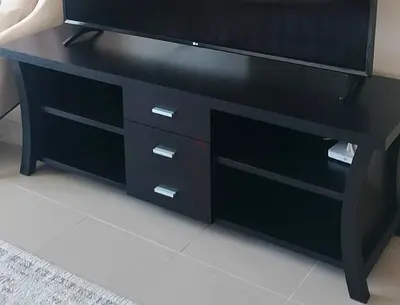 Dark wood TV stand with 3 drawers and open shelves - like new condition
