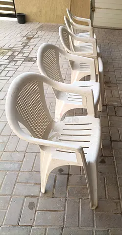 Set of 5 white Cosmoplast plastic outdoor chairs