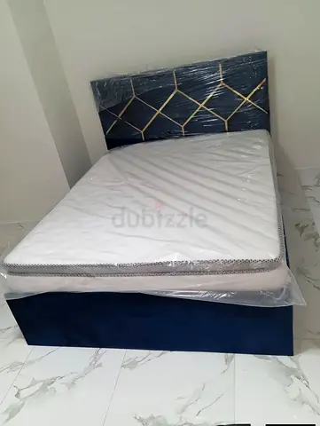 Queen size bed with upholstered headboard and new mattress (blue)