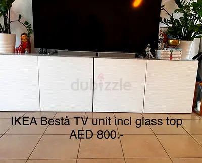 IKEA Besta TV unit with glass top - white, good condition. 4 cupboards.